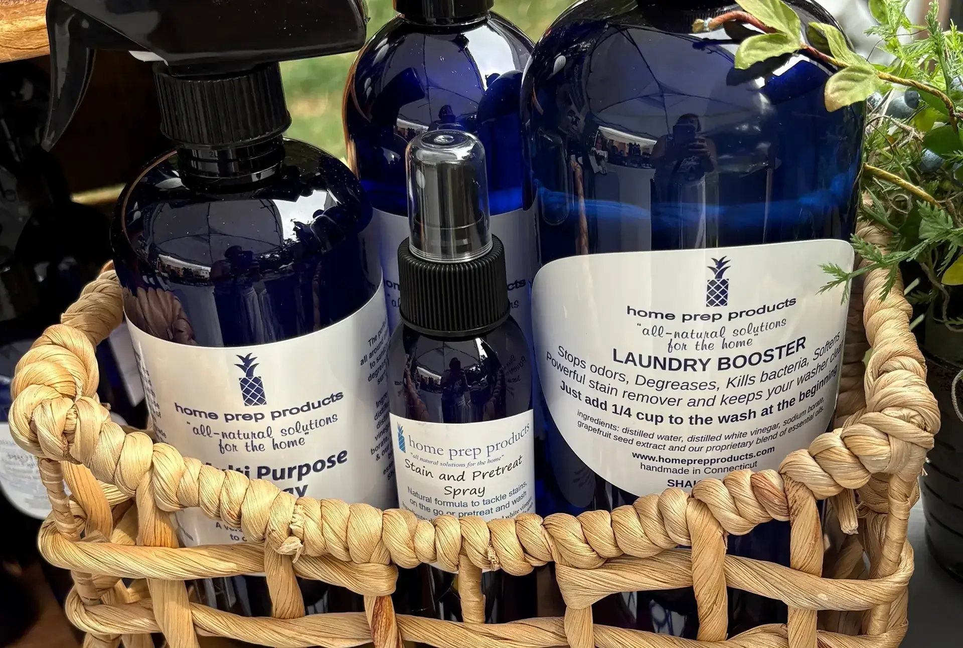 Blue bottles of laundry and fabric care products in a basket.
