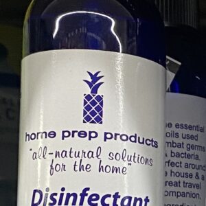 Blue disinfectant room spray bottle with label